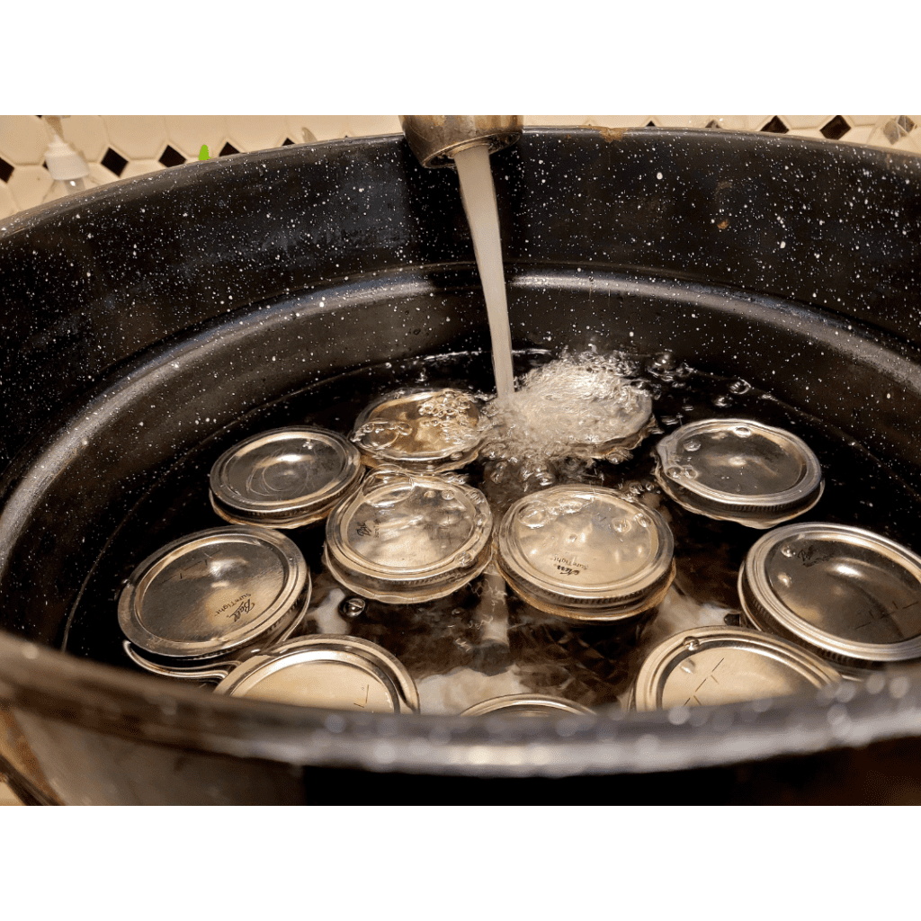 Image illustrates a water bath canner for a roasted pepper jam recipe.