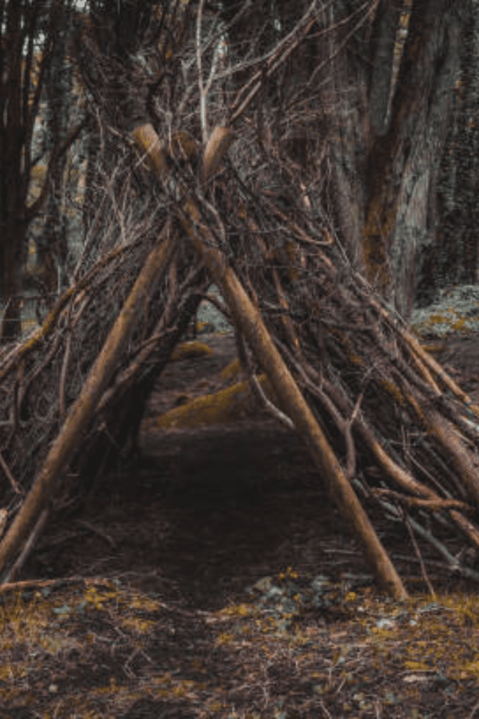 Image illustrates a survival shelter for SHTF planning. 