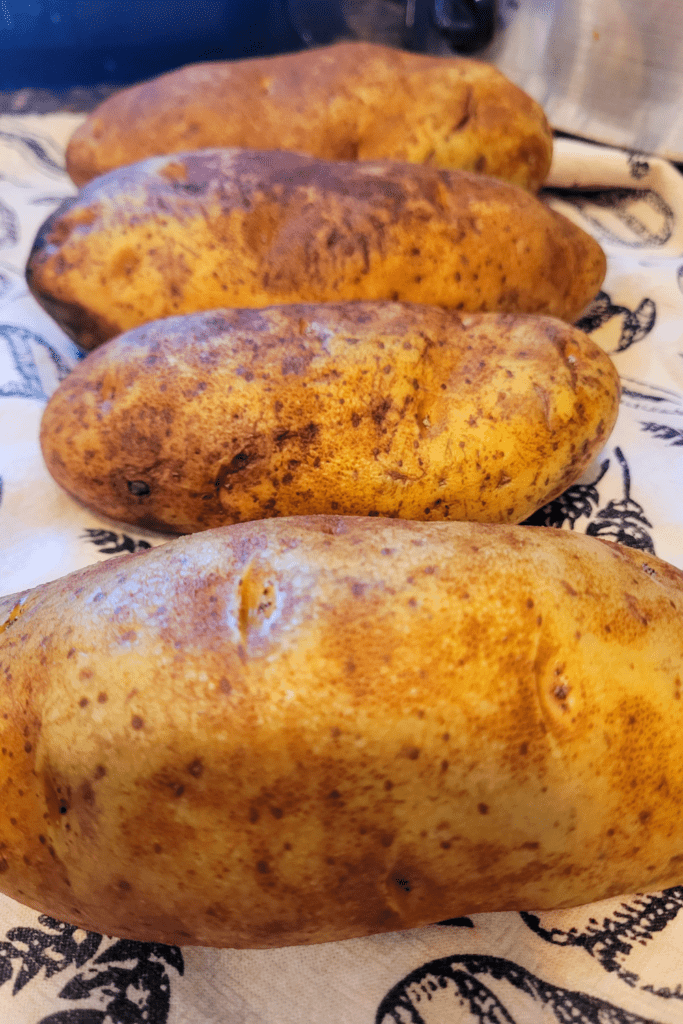 Image illustrates potatoes for twice baked potatoes casserole.