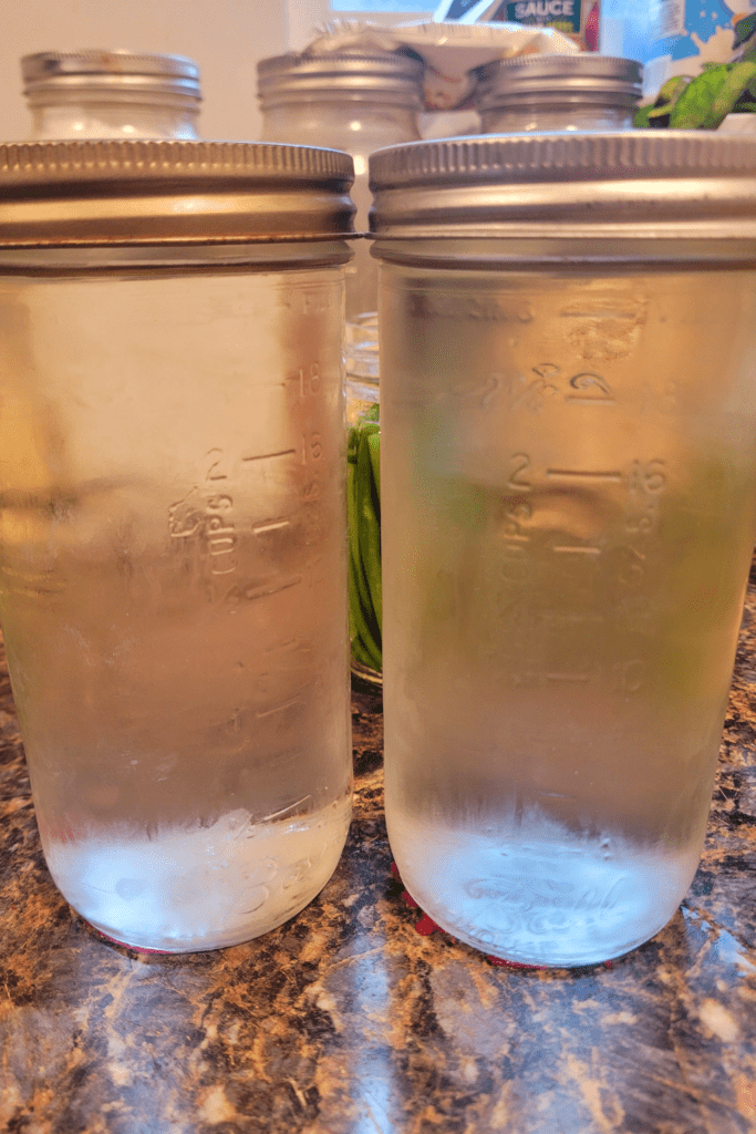 Image illustrates jars of pickling brine.