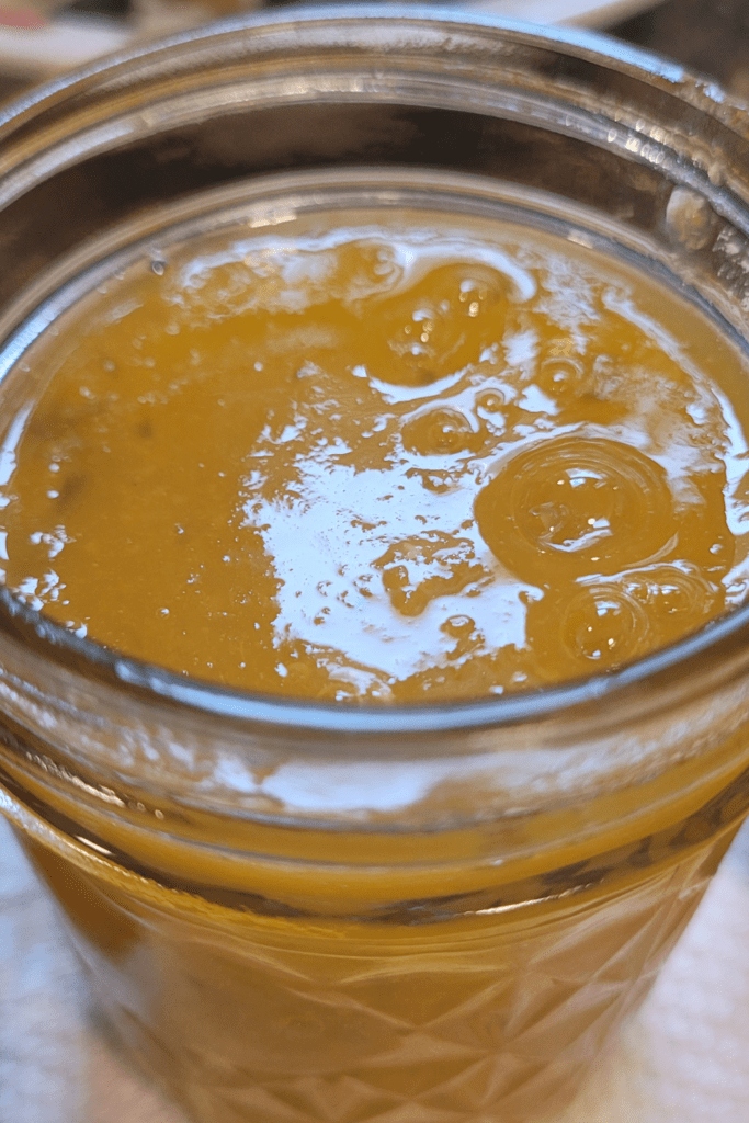 Image illustrates peach jalapeno jam.