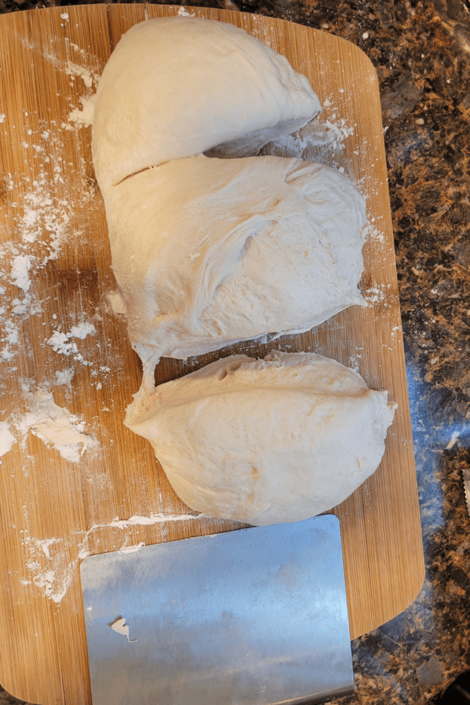 Image illustrates dough separated for a bread braid.