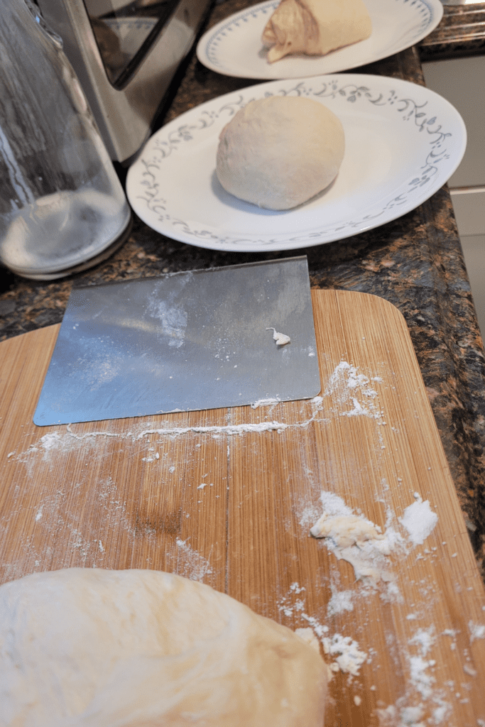 Image illustrates dough separated for a bread braid.