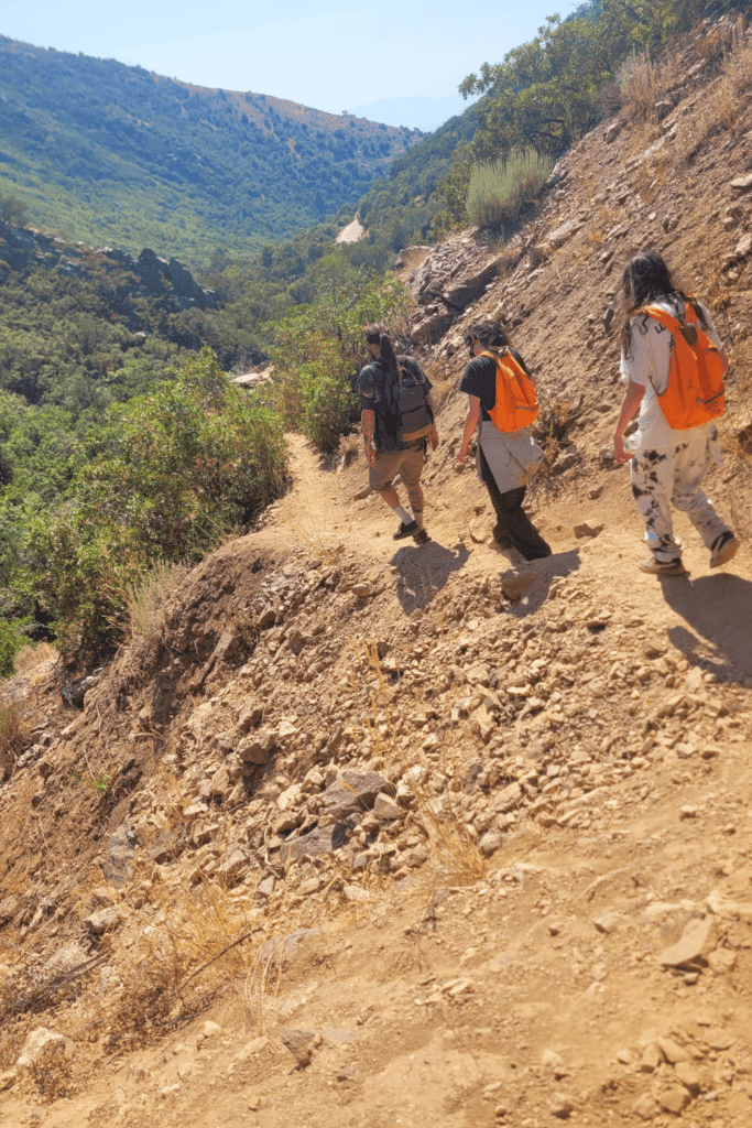 Image illustrates hikers hiking the high desert.