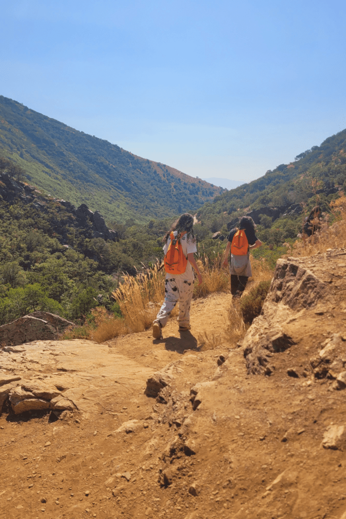 Image illustrates hikers hiking the high desert.