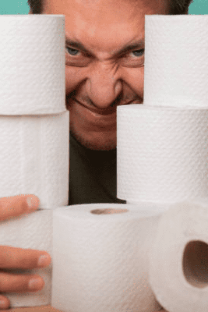 Image illustrates a man hoarding toilet paper for end times headlines.