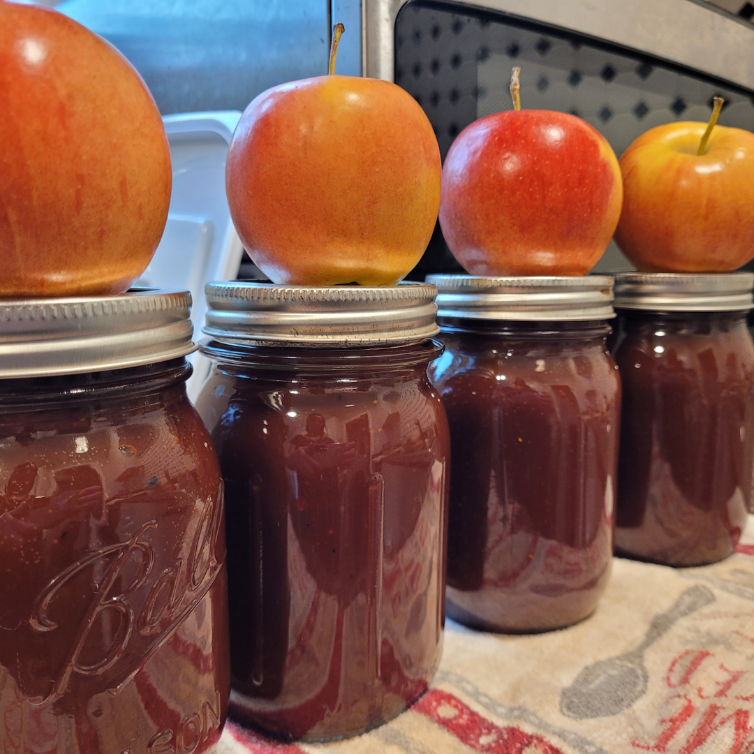 Image illustrates apple butter in crockpot.