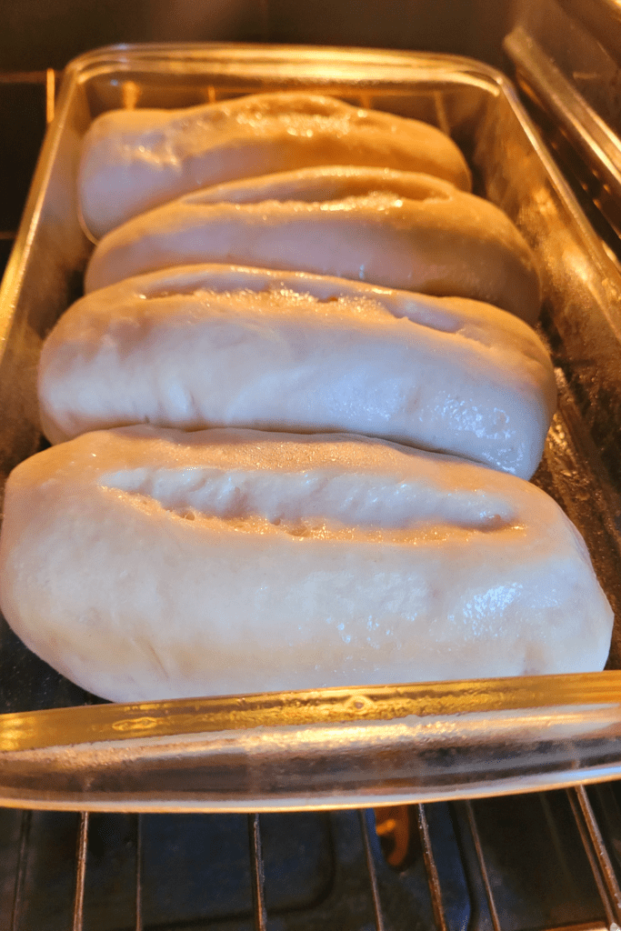 Image illustrates hoagies made from scratch for a hoagie buns recipe.