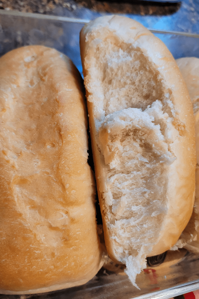 Image illustrates hoagies made from scratch for a hoagie buns recipe.