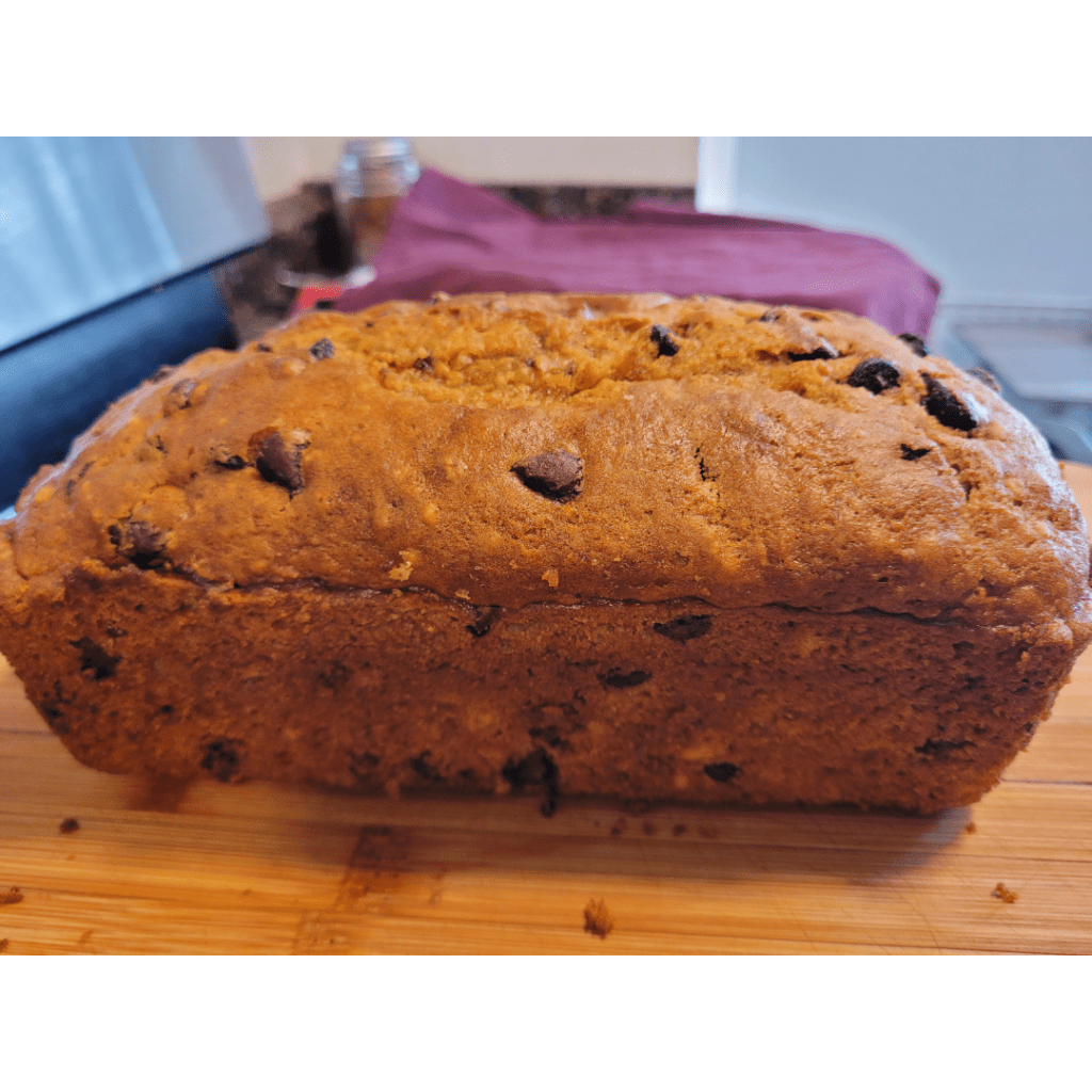 Image illustrates chocolate chip pumpkin bread. 