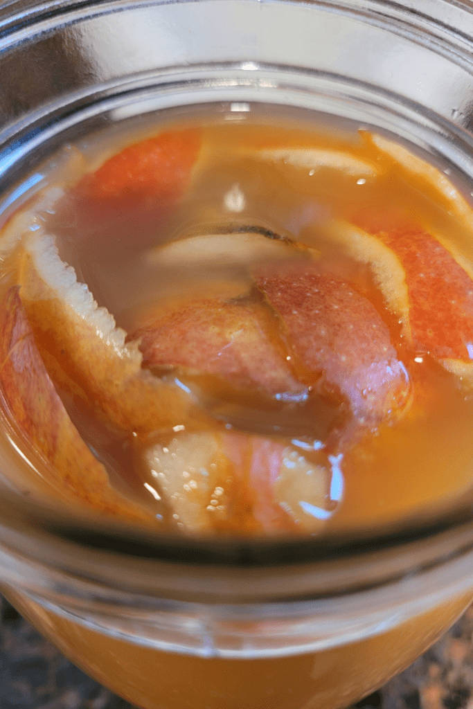 Image illustrates homemade apple cider vinegar.