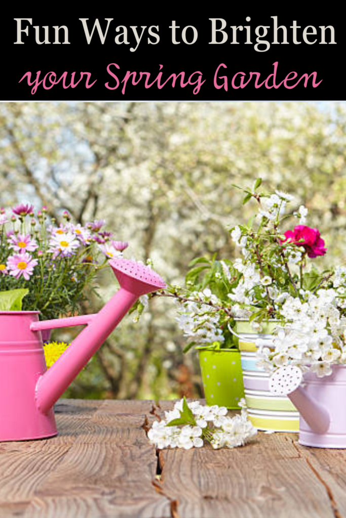 Image illustrates watering can flower pots for a spring garden.
