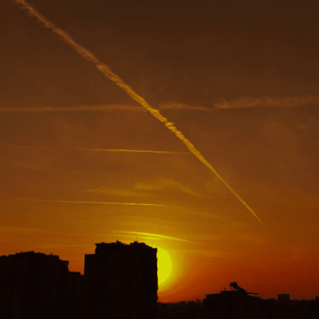 Image illustrates a blackout sun with chemtrails and fog.