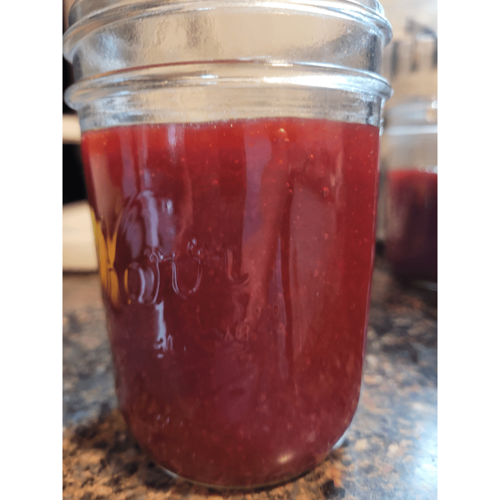 Image illustrates canning cherry plum jam.