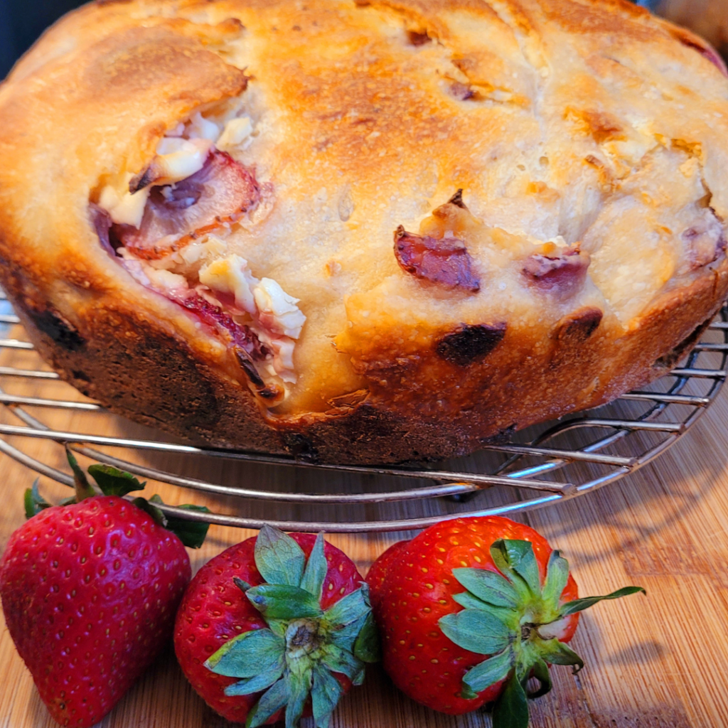 Image illustrates strawberries and cream sourdough bread.