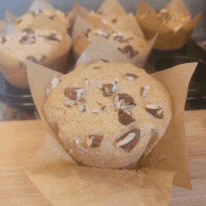 Image illustrates sourdough banana muffins.