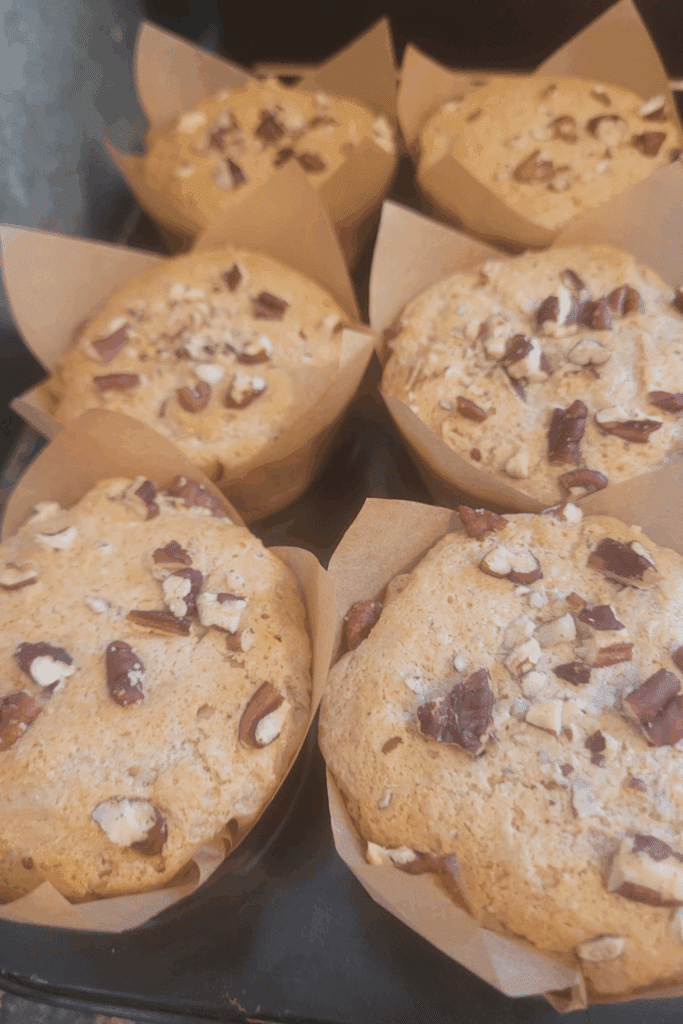 Image illustrates sourdough banana muffins.