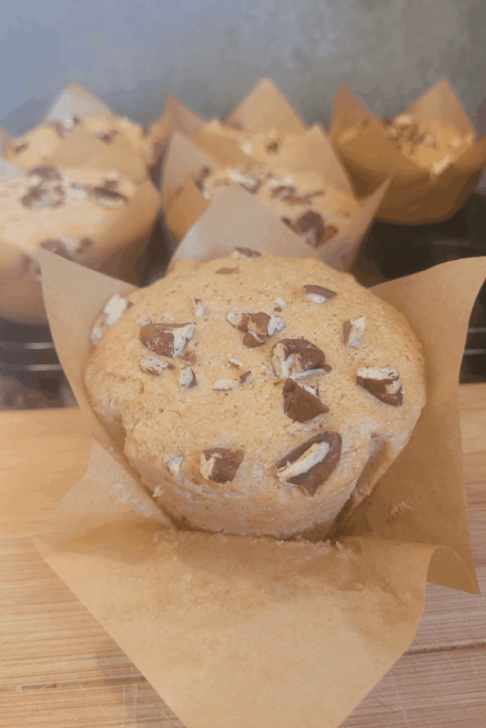 Image illustrates sourdough banana muffins.