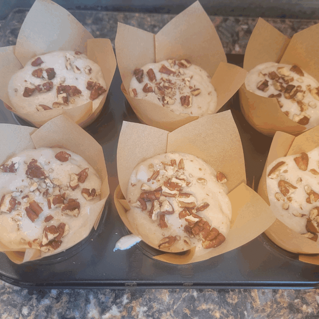 Image illustrates sourdough banana muffins.