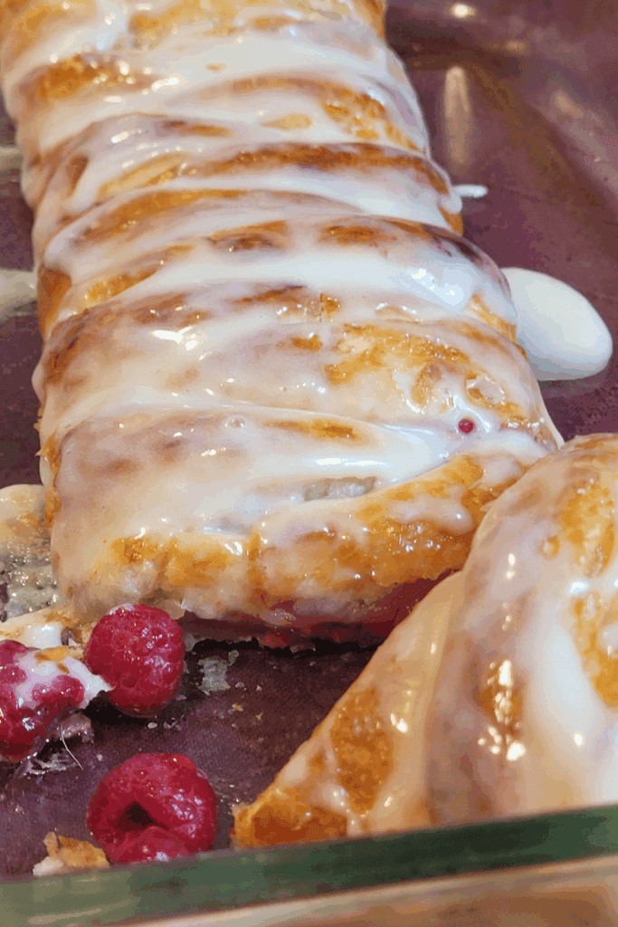 Image illustrates puff pastry raspberry and cream butter braid.