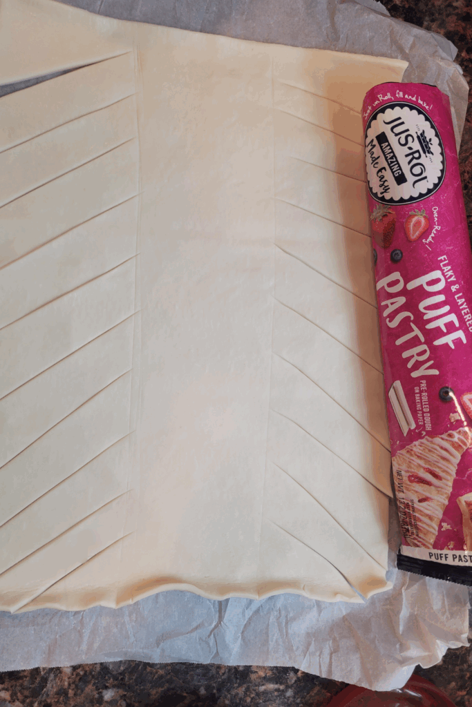 Image illustrates puff pastry raspberry and cream butter braid.