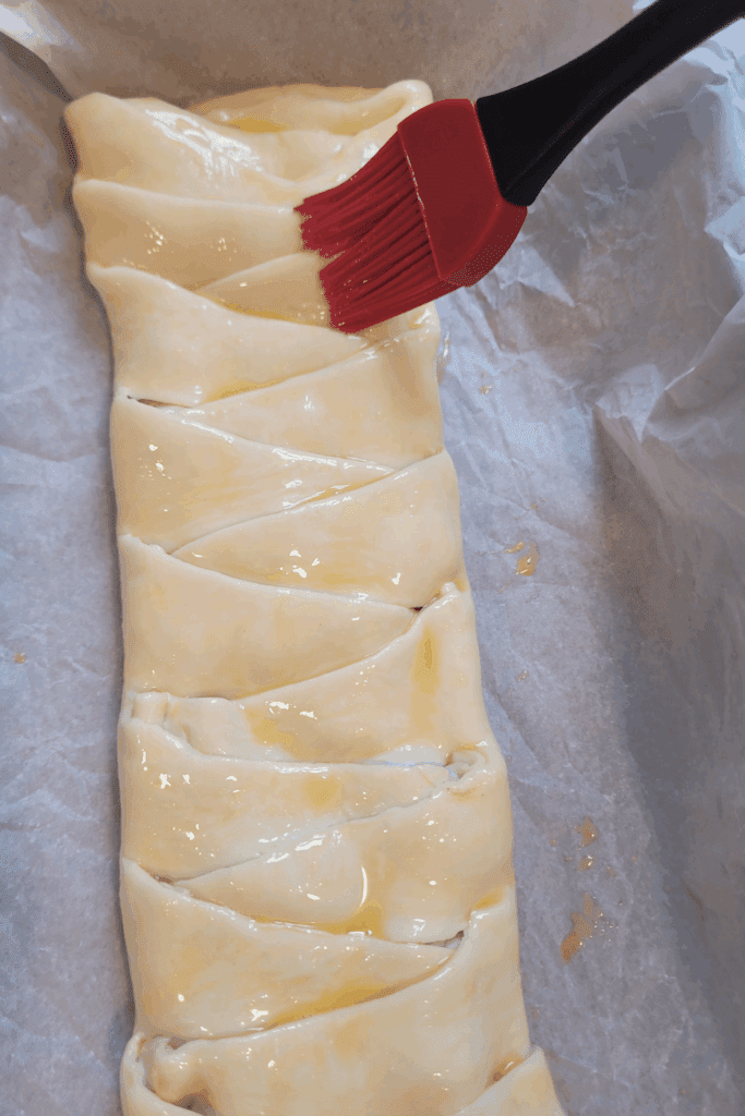 Image illustrates puff pastry raspberry and cream butter braid.