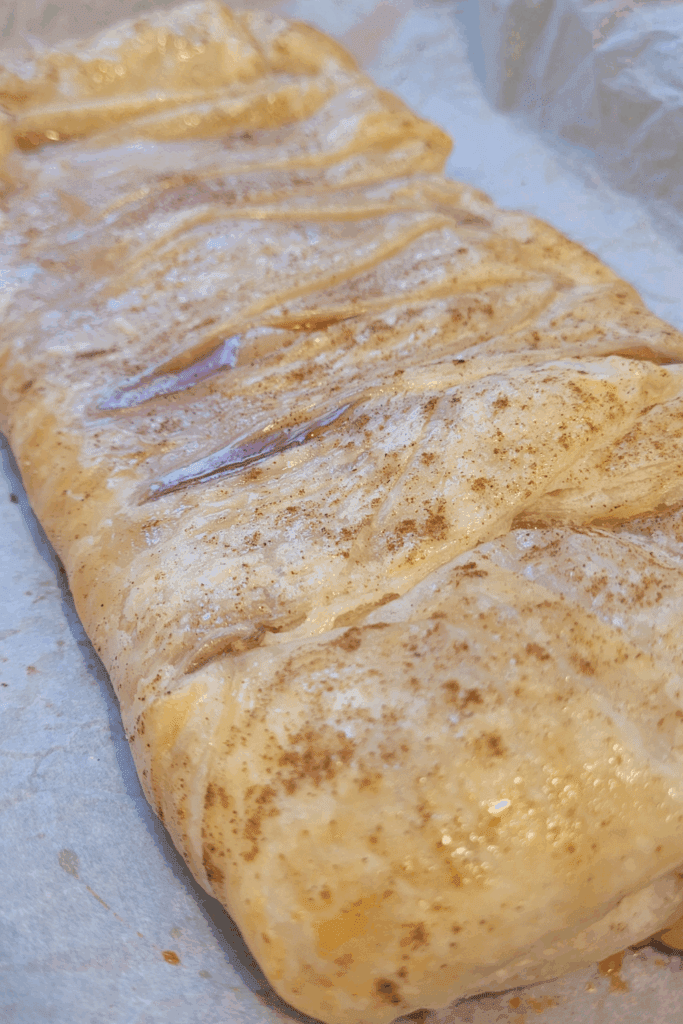 Image illustrates puff pastry peaches and cream butter braid.