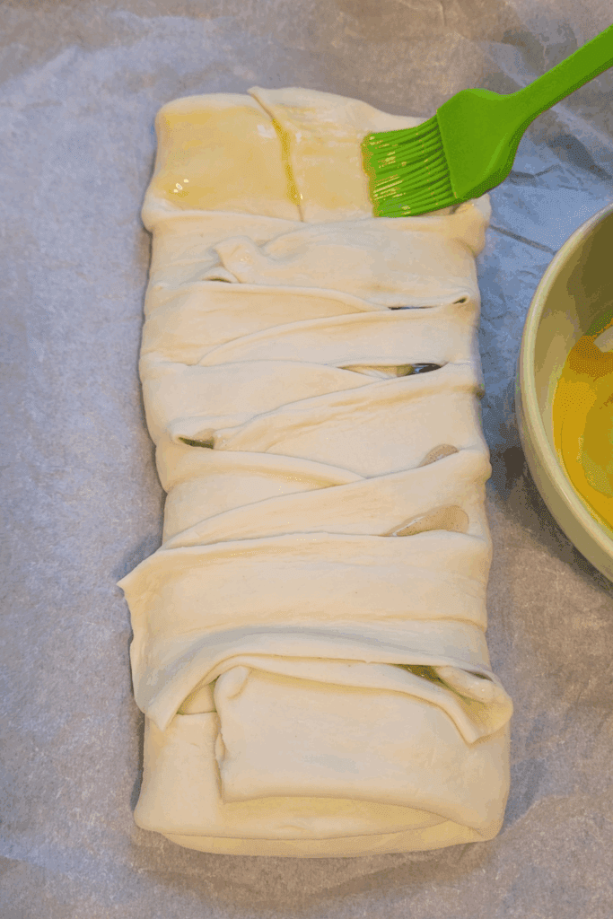 Image illustrates puff pastry peaches and cream butter braid.
