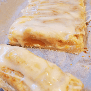 Image illustrates puff pastry peaches and cream butter braid.