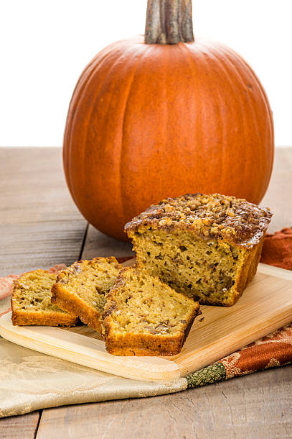 Image illustrates pumpkin zucchini bread.
