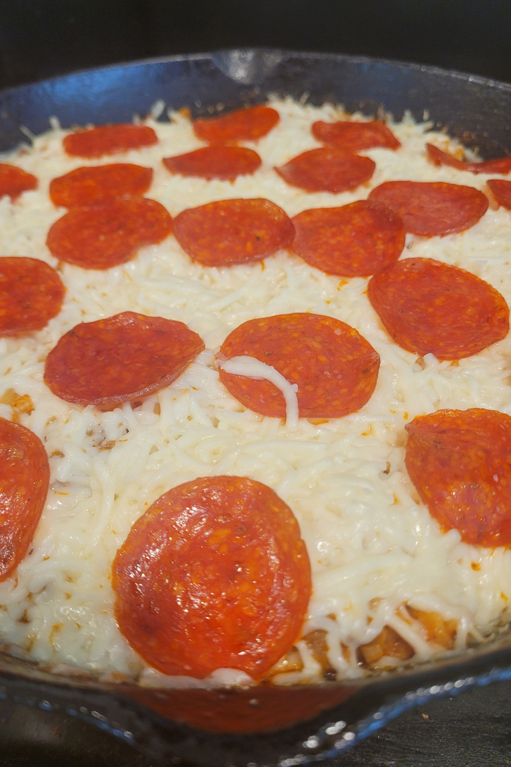 Image illustrates pizza casserole.