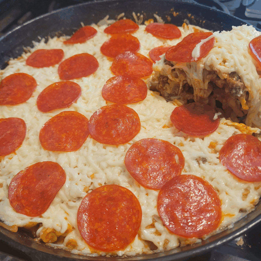 Image illustrates pizza casserole.