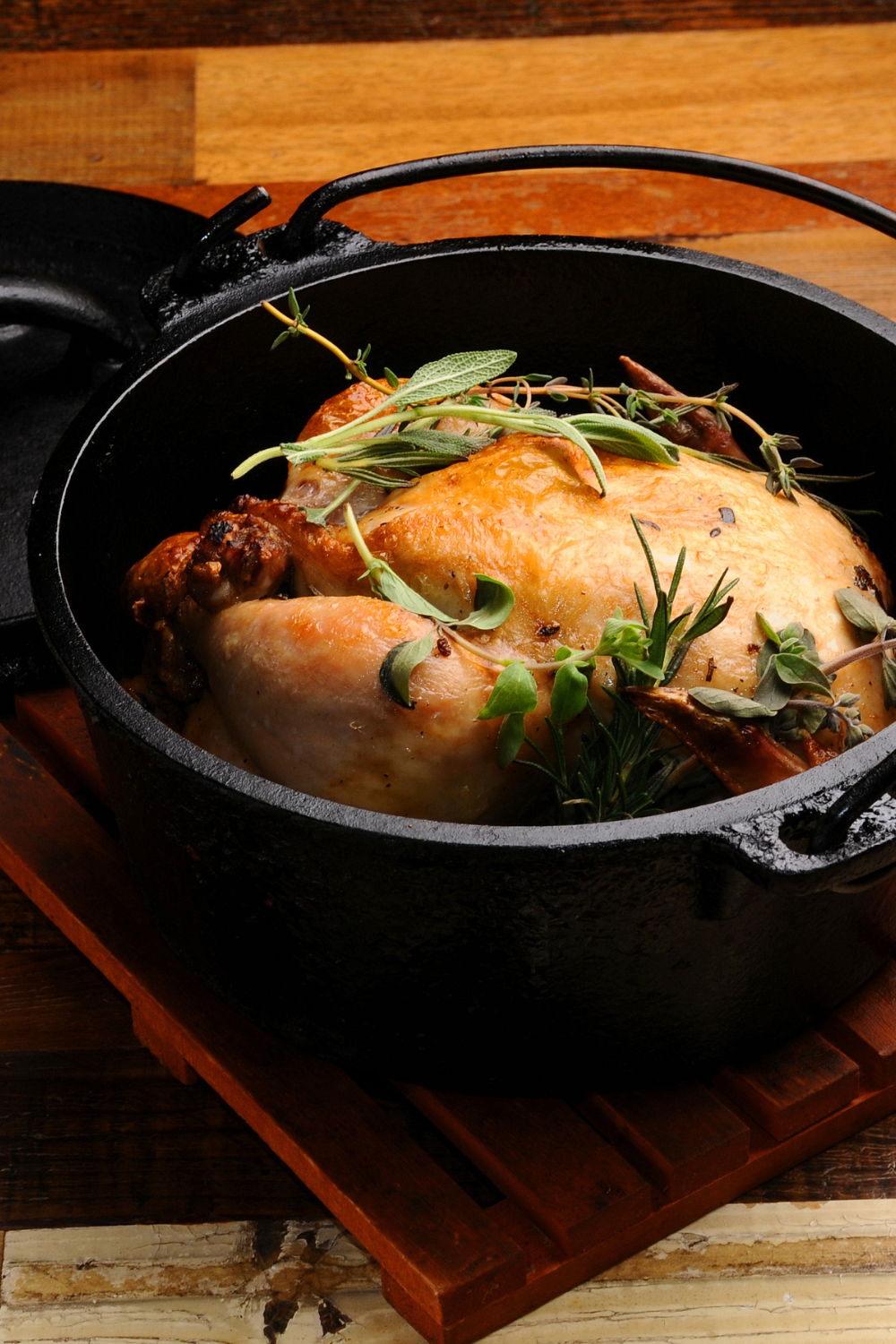 Image illustrates a cast iron Dutch oven baking food to prep your home for chilly fall nights.