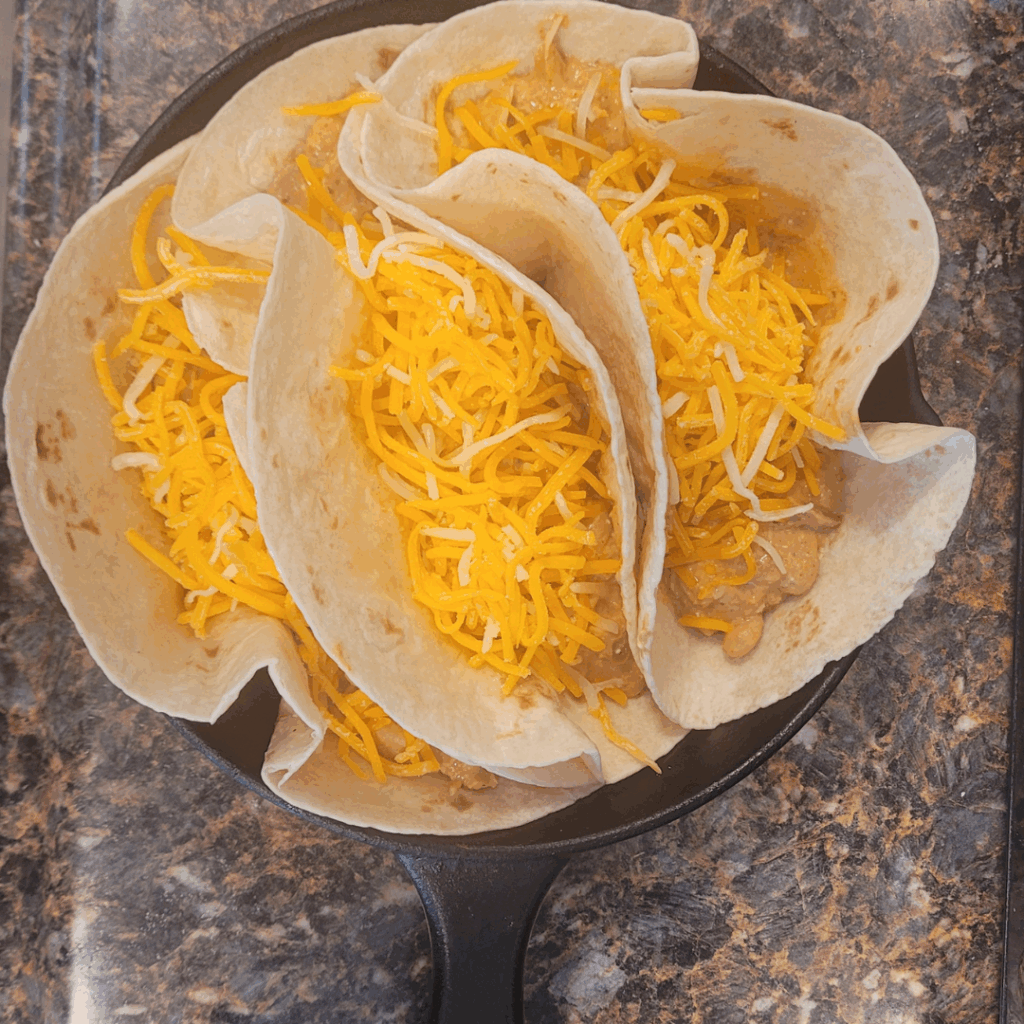 Image illustrates creamy chicken tacos.