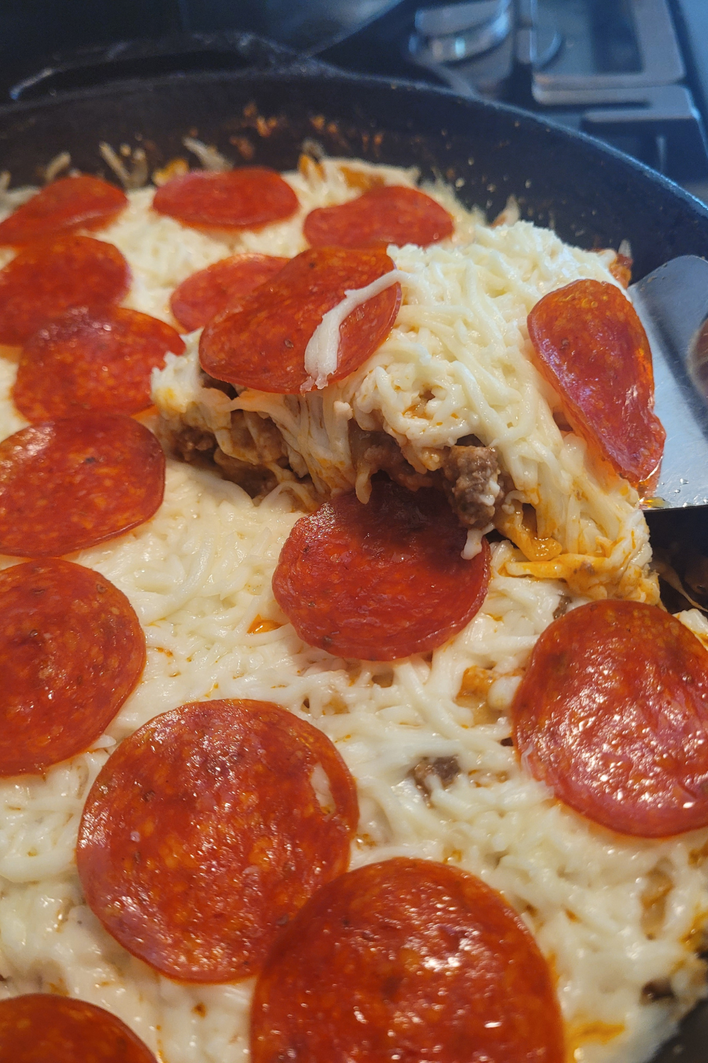 Image illustrates pizza casserole.
