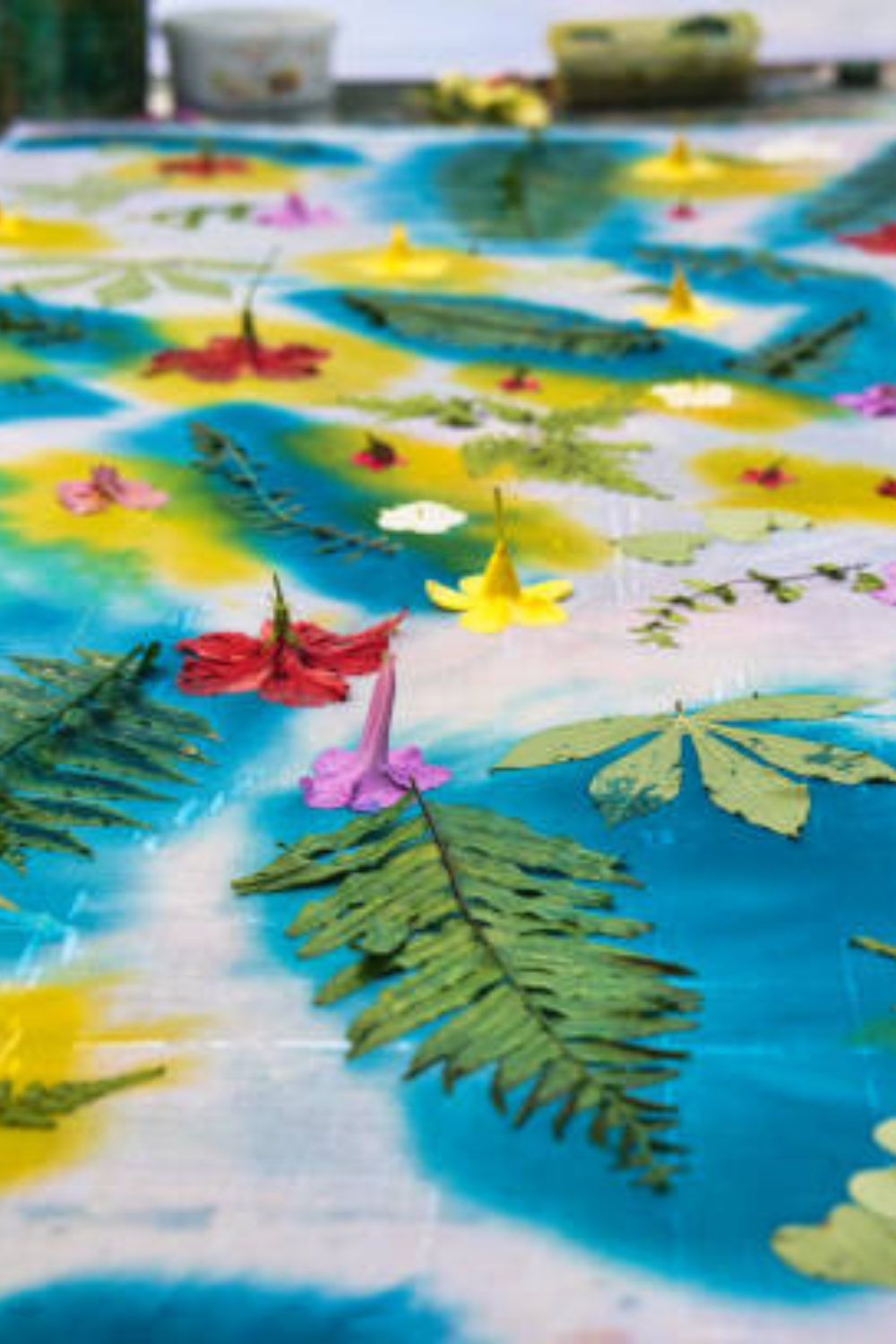 Image illustrates nature crafts for kids leaf printing on fabric.