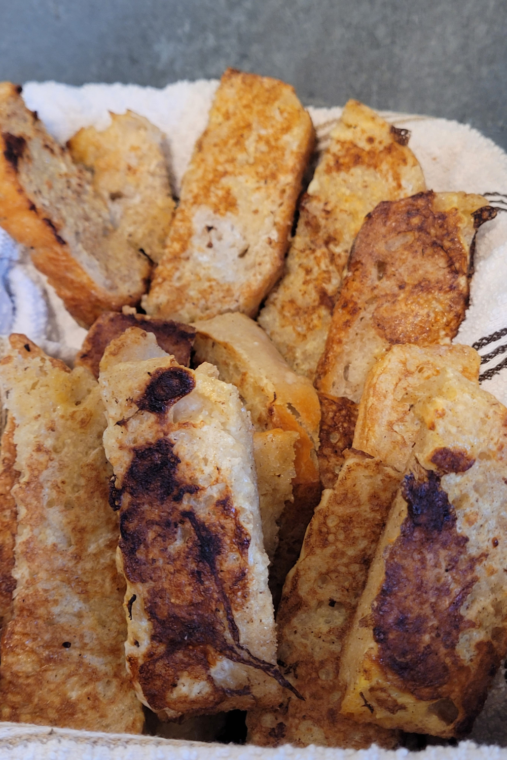 Image illustrates homemade French toast sticks.