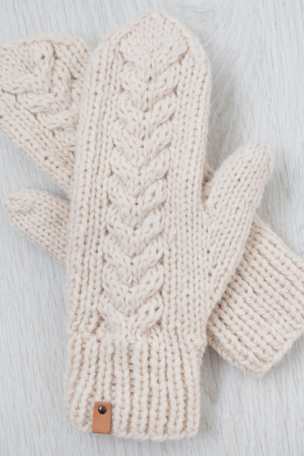 Image illustrates knitted mittens for handmade Christmas gifts.