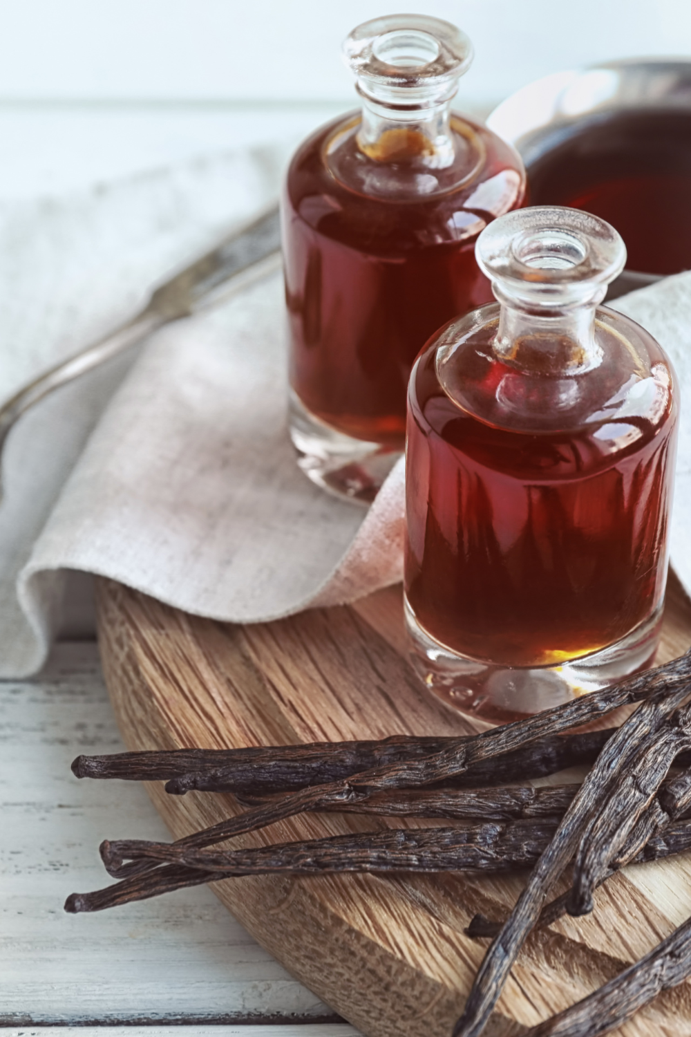 Image illustrates homemade vanilla extract for handmade Christmas gifts.