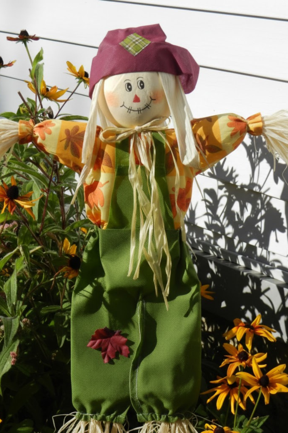 Image illustrates a scarecrow for how to make a scarecrow.