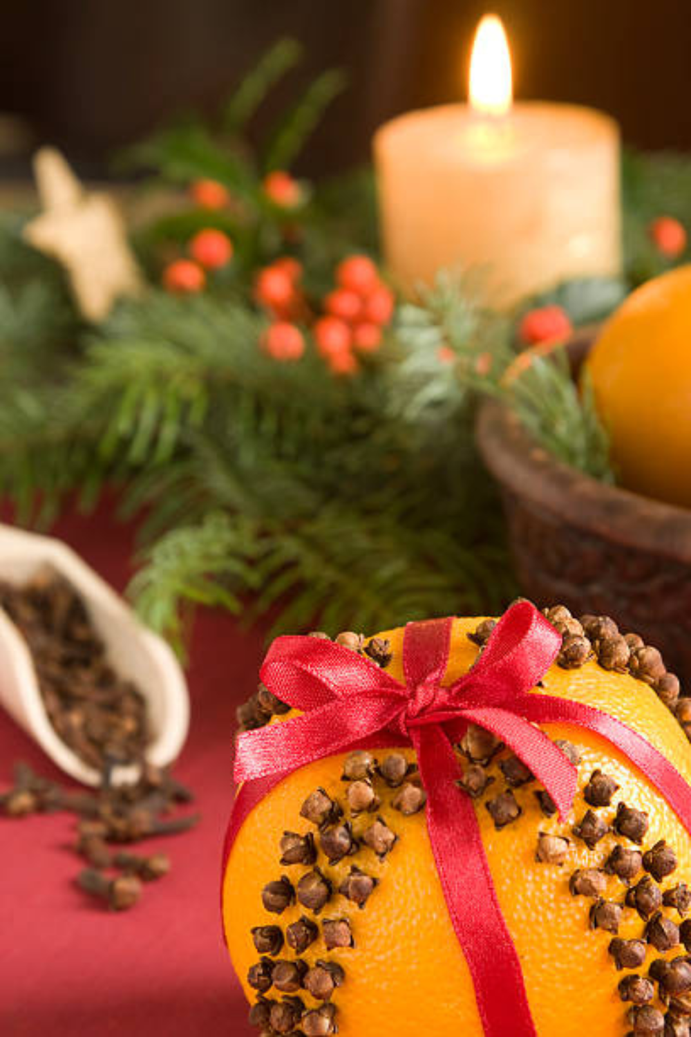 Image illustrates oranges for how to make clove-studded pomanders.