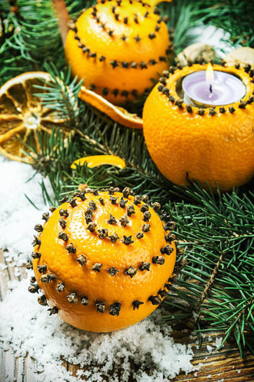 Image illustrates oranges for how to make clove-studded pomanders.