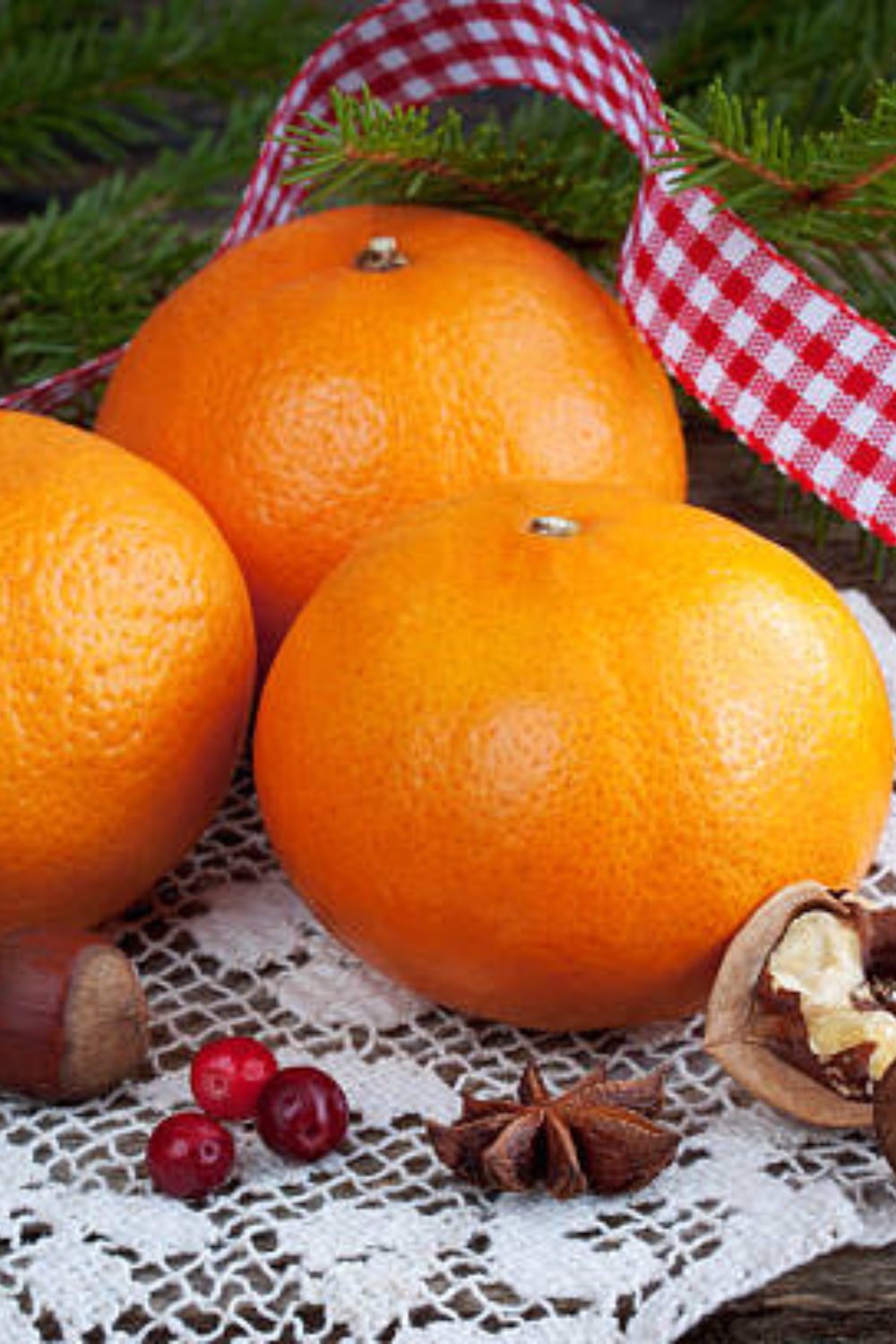 Image illustrates oranges for how to make clove-studded pomanders.