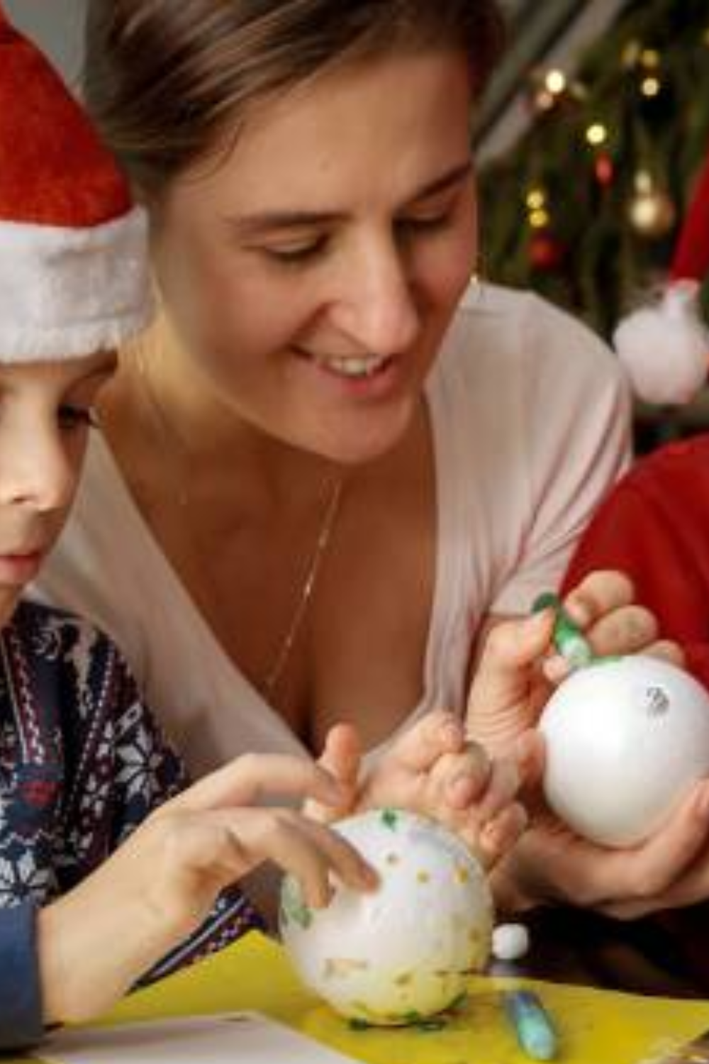 Image illustrates Styrofoam ball Christmas ornaments for easy Christmas crafts for kids.