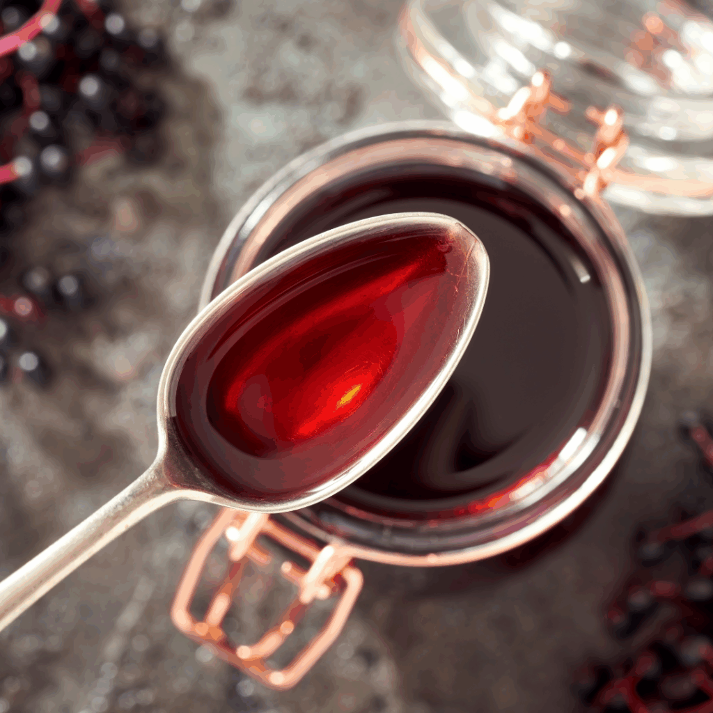Image illustrates elderberry syrup.