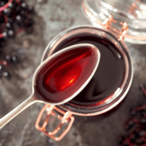 Image illustrates elderberry syrup.