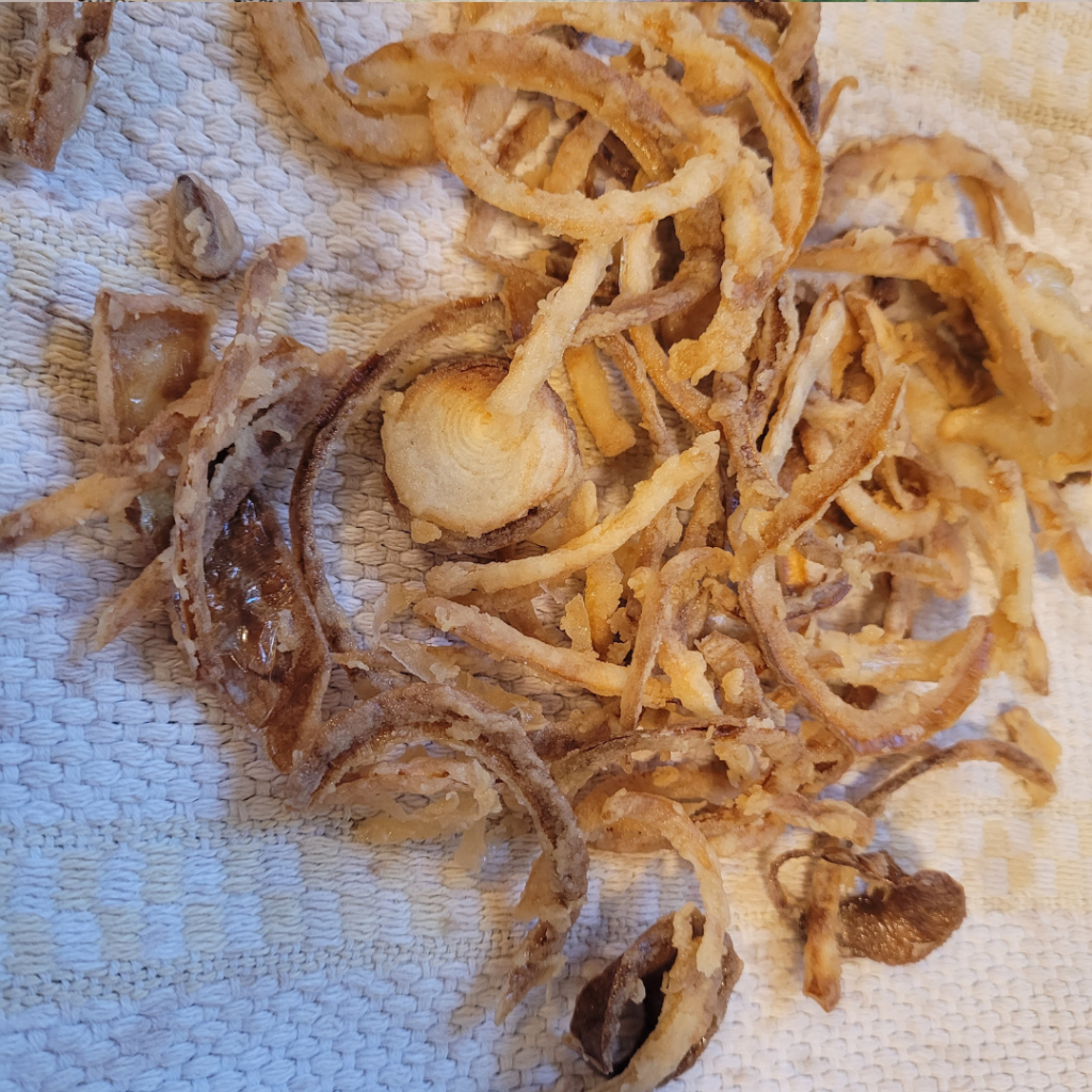 Image illustrates sliced onions for homemade fried onions.