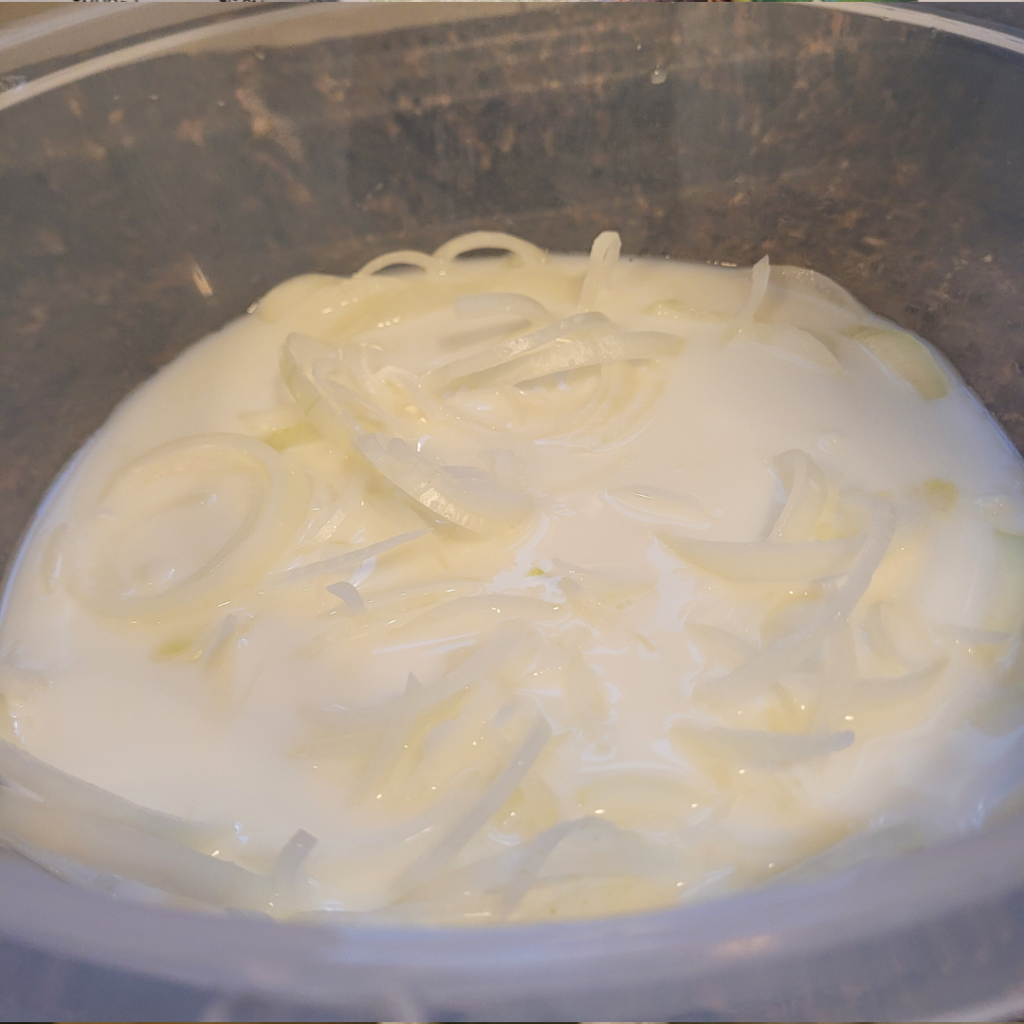 Image illustrates sliced onions for homemade fried onions.