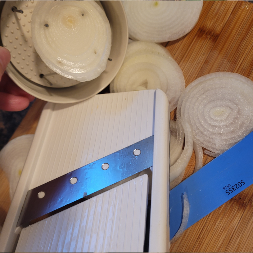 Image illustrates sliced onions for homemade fried onions.