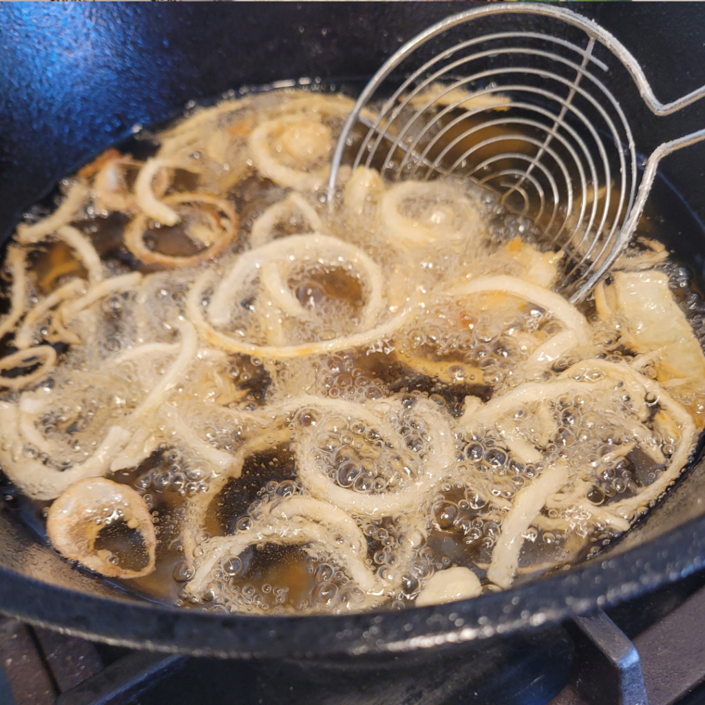 Image illustrates sliced onions for homemade fried onions.